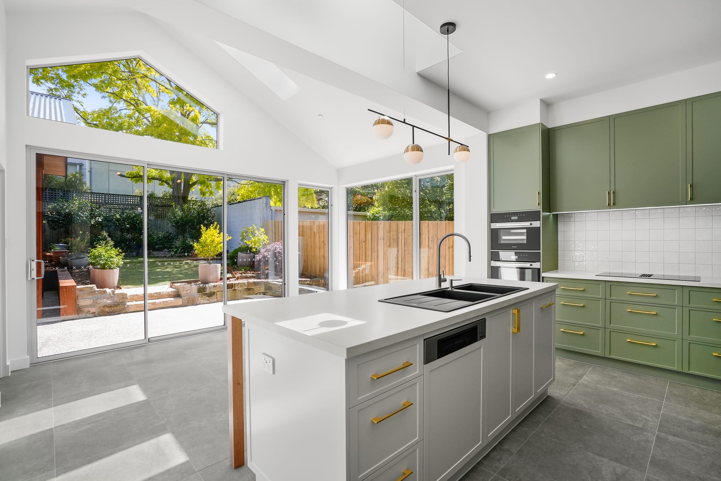 Green kitchen cabinetry at Verndene, Sandy Bay
